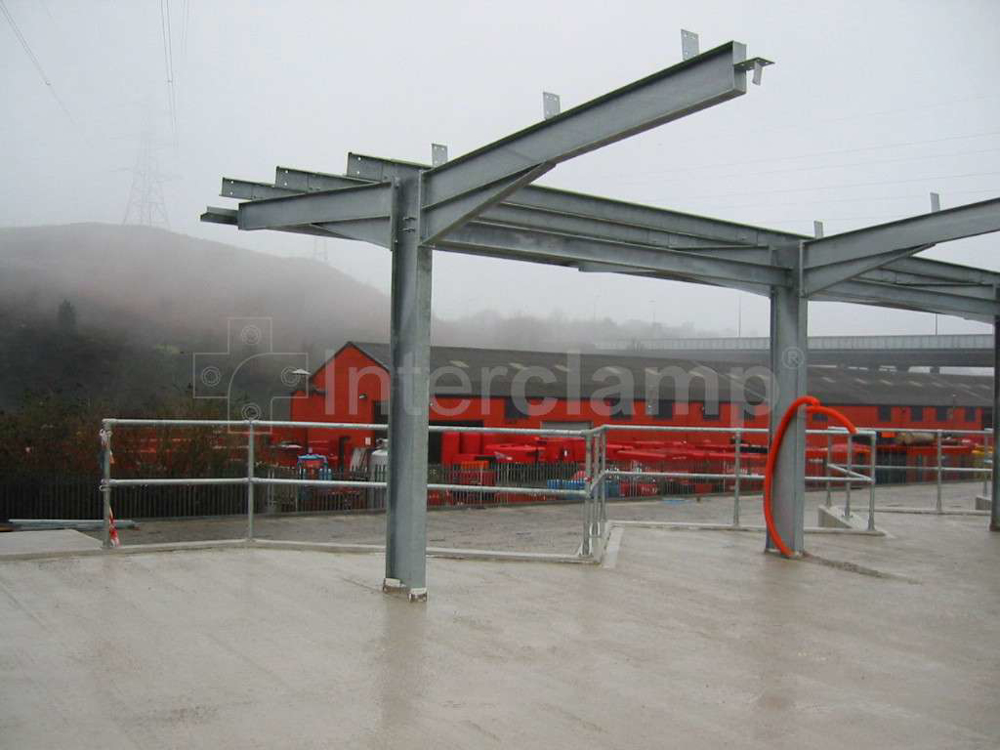 Civic amenity site featuring safety guardrails made from Interclamp pipe clamp fittings and tubes, enhancing safety for those disposing of waste and recyclables.